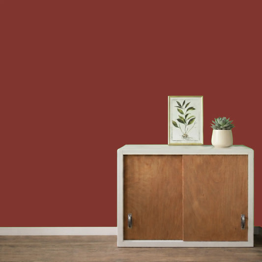 Mur repeint avec la couleur Antik rouge, peinture murale Éléonore Déco.