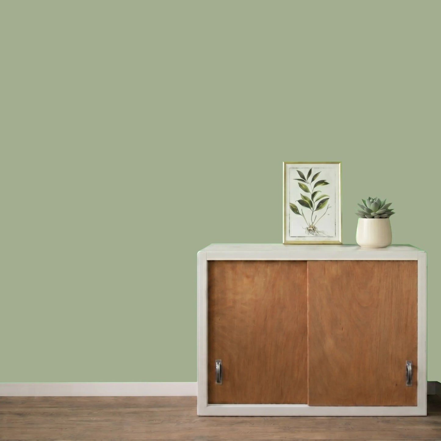 Mur repeint avec la couleur Fenouil, peinture murale Éléonore Déco.