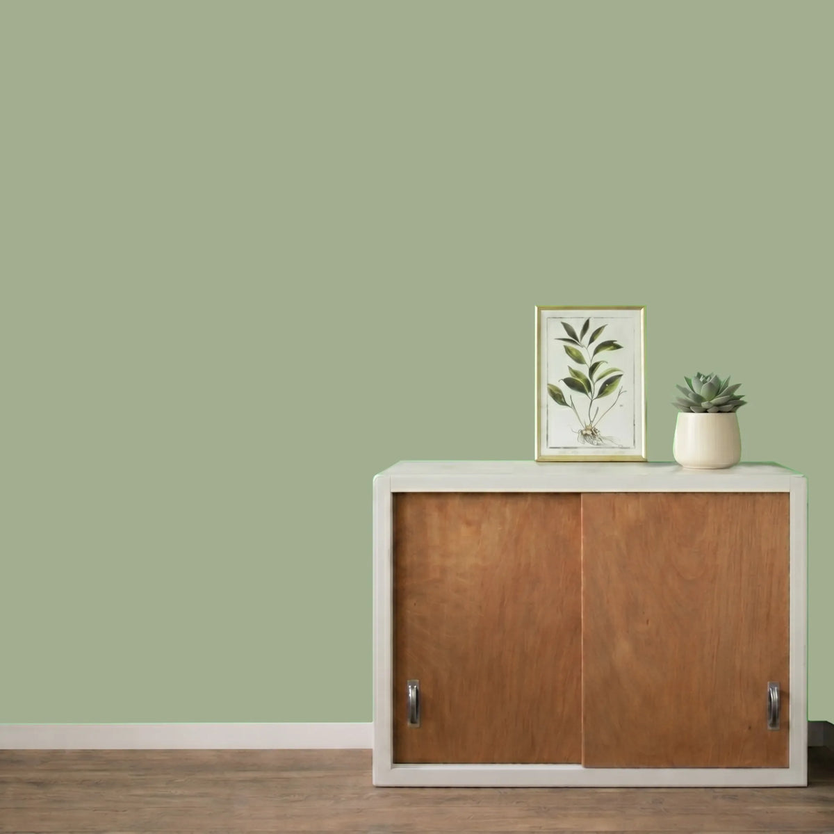 Mur repeint avec la couleur Fenouil, peinture murale Éléonore Déco.