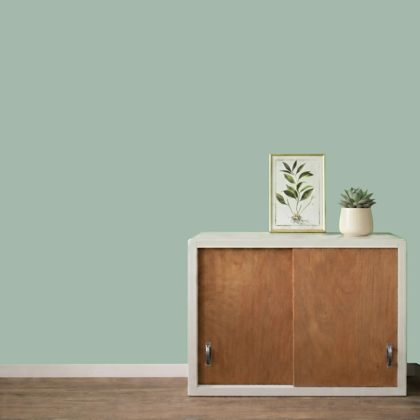 Mur repeint avec la couleur Jade, peinture murale Éléonore Déco.