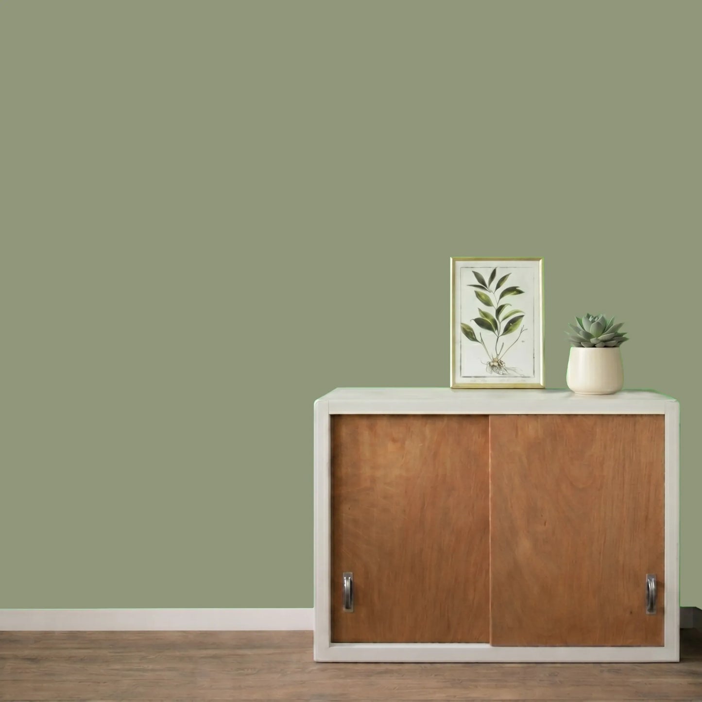 Mur repeint avec la couleur Vert de gris, peinture murale Éléonore Déco.